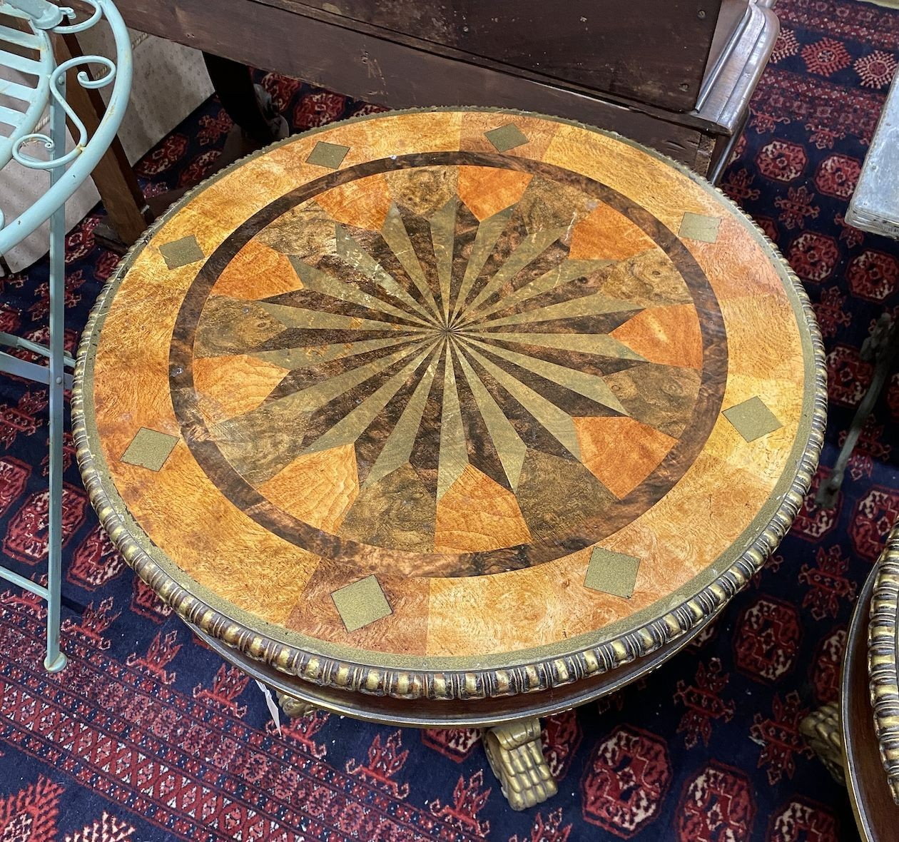 A pair of Empire style circular wood and composition faux parquetry occasional tables, diameter 69cm, height 69cm
